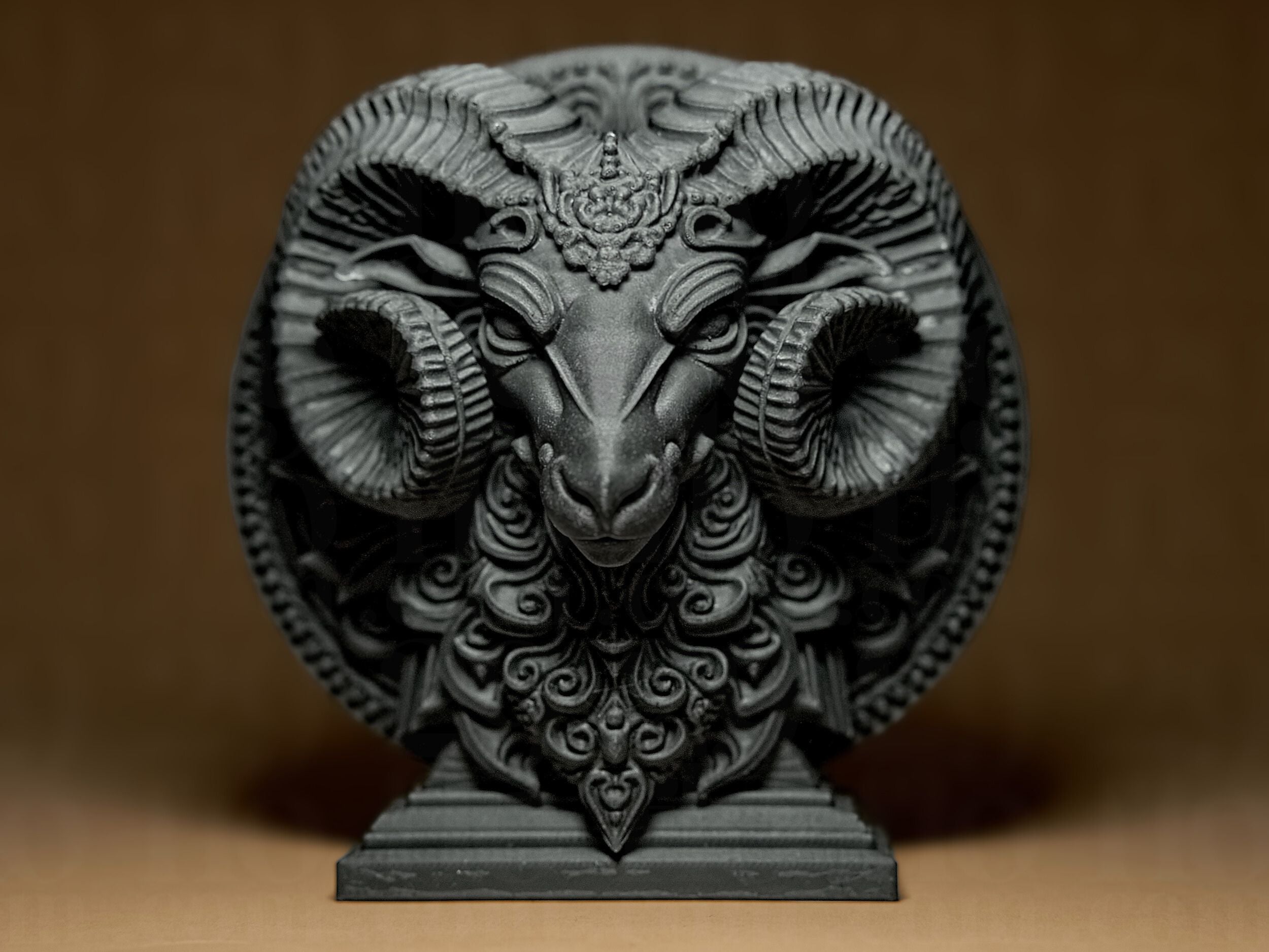 Decorative ram head sculpture on a brown background
