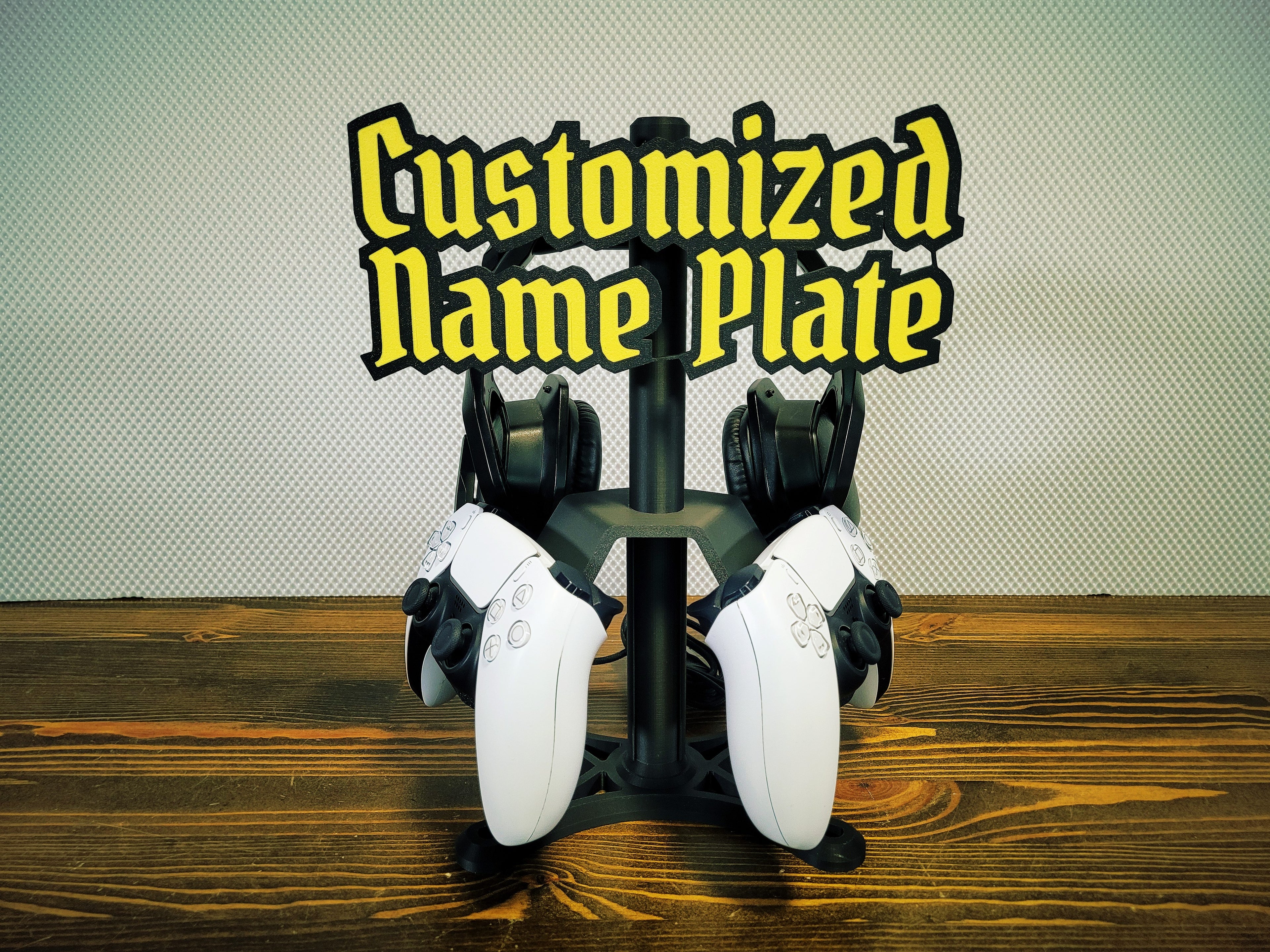 PS5 controller and headphone stand with personalized nameplate, front view