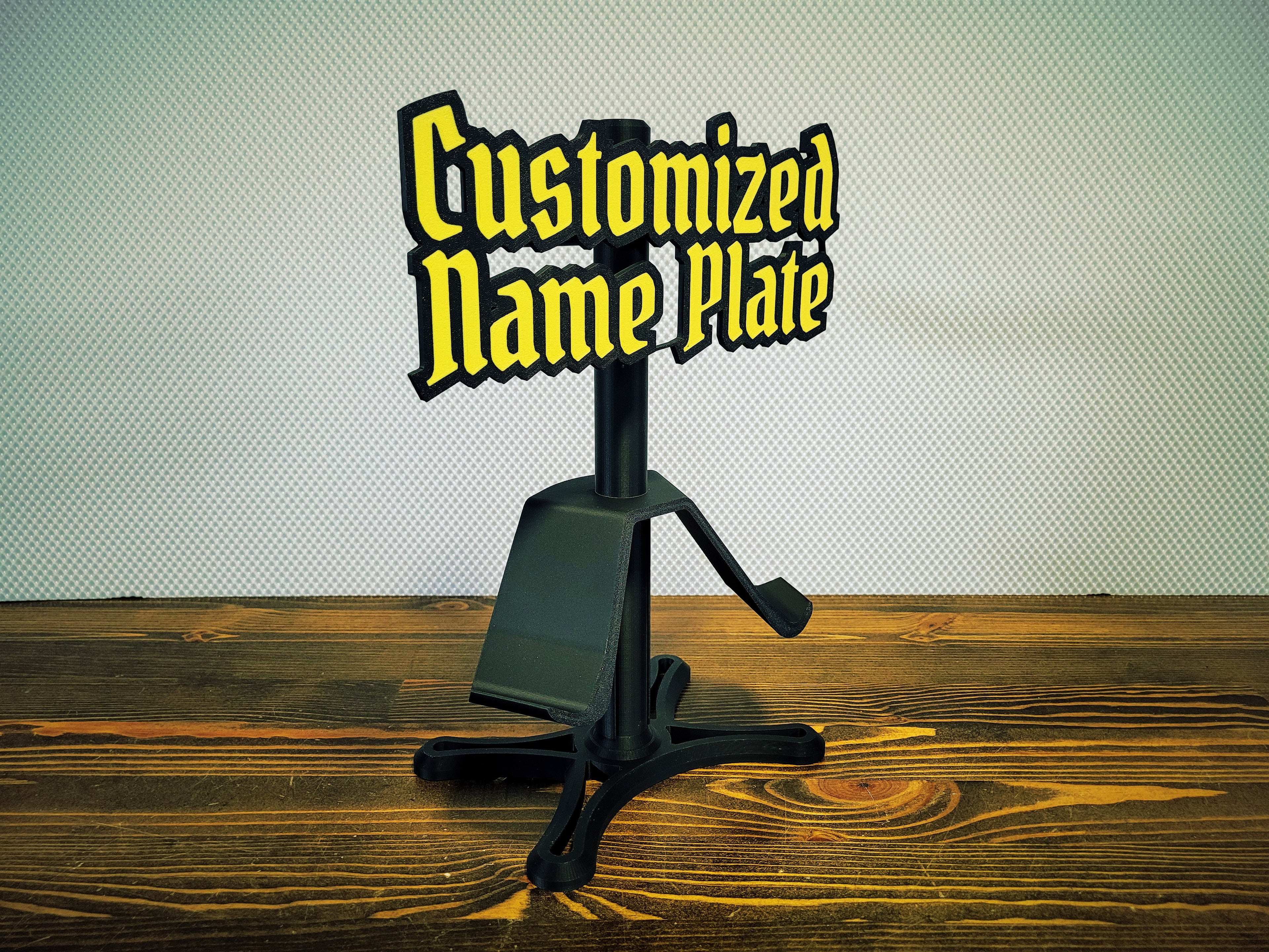 Customized name plate holder on a wooden surface